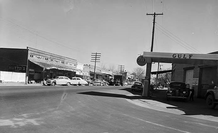 East Main Street in Ariton in 1951, brick storefronts and period cars