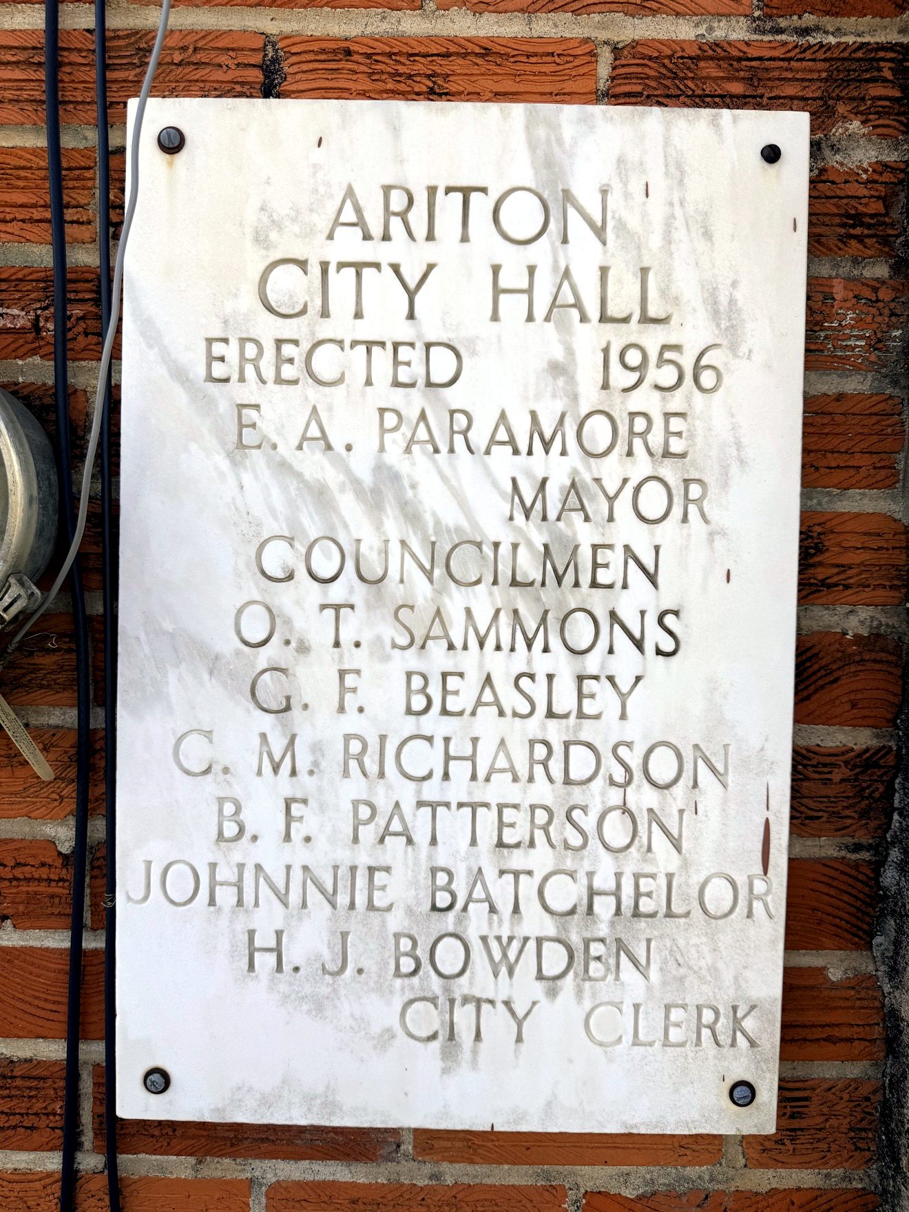 The Ariton City Hall cornerstone plaque — erected 1956, naming the mayor, councilmen and city clerk